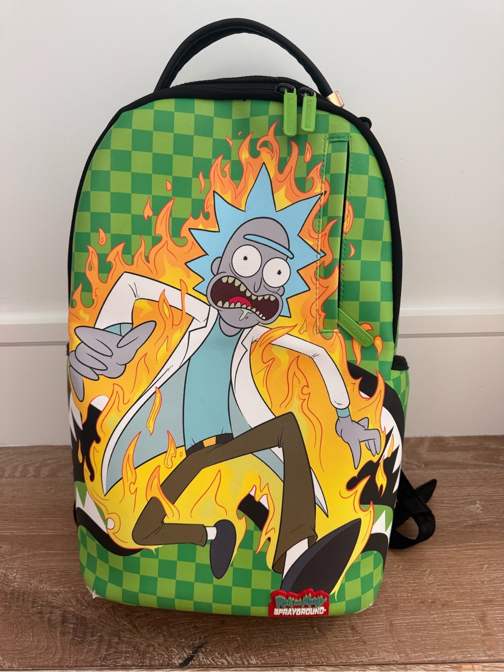 Sprayground x Rick and Morty “Fire Rick” backpack in green checker colorway - Picture 1 of 5